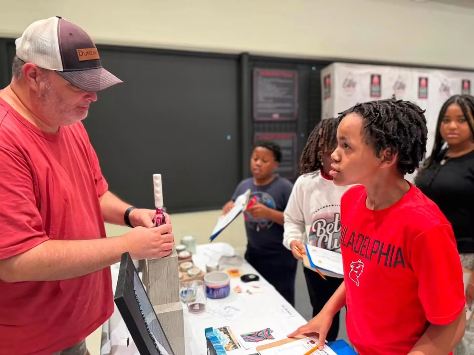Students in entrepreneur club speak with local business owners at the first meeting. 